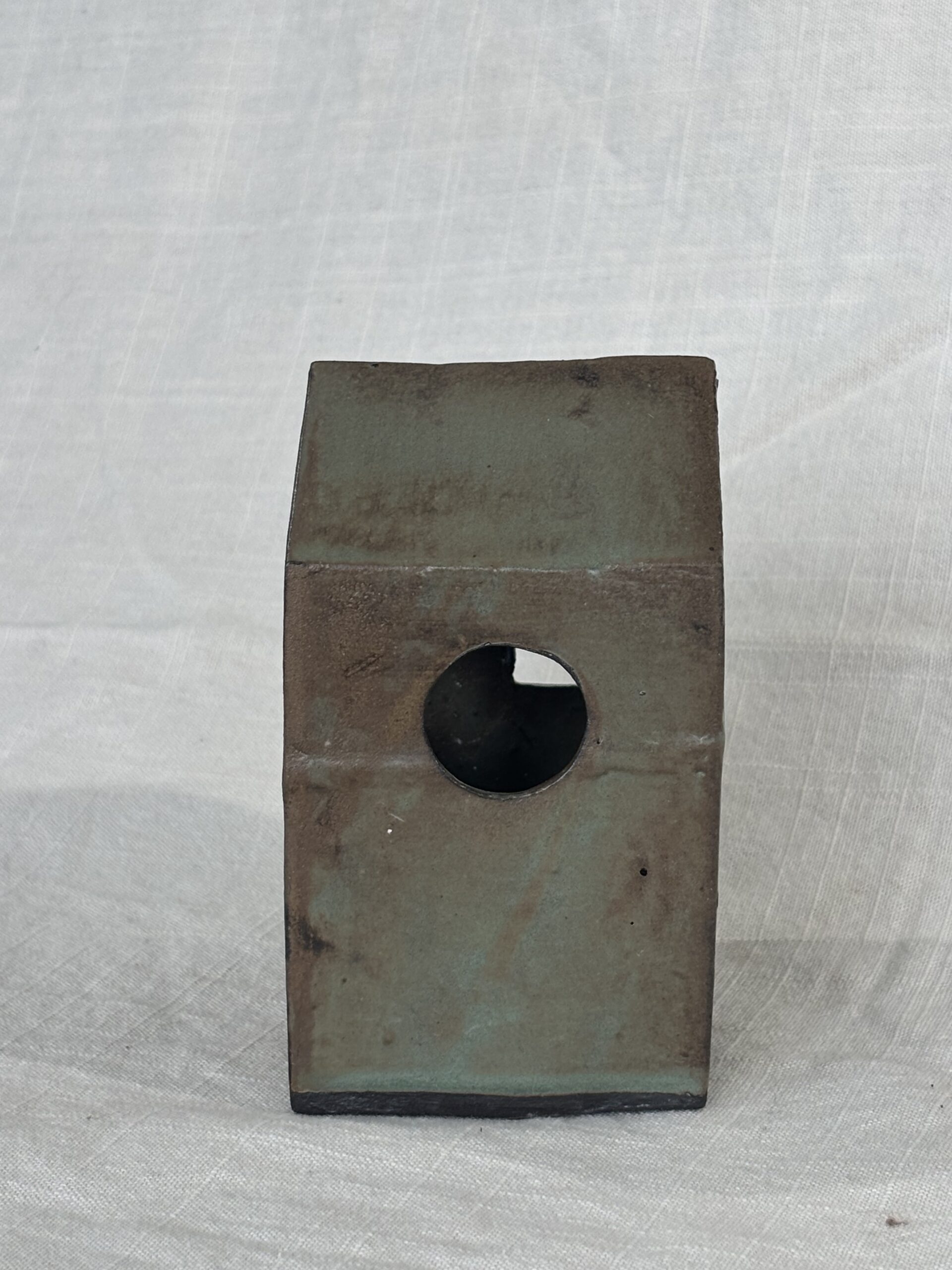 Small, rustic metal house sculpture